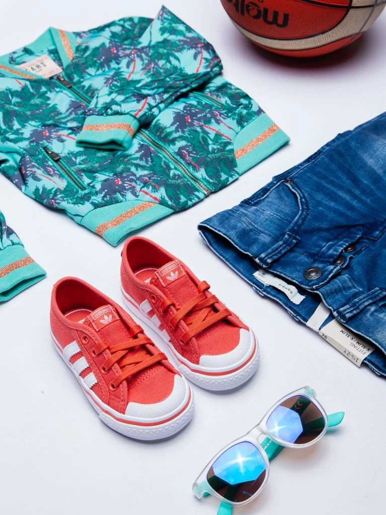 Outdoor Voices-style athletic apparel flat lay representing a referral program